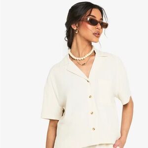 Cream pin stripped button down woman’s blouse